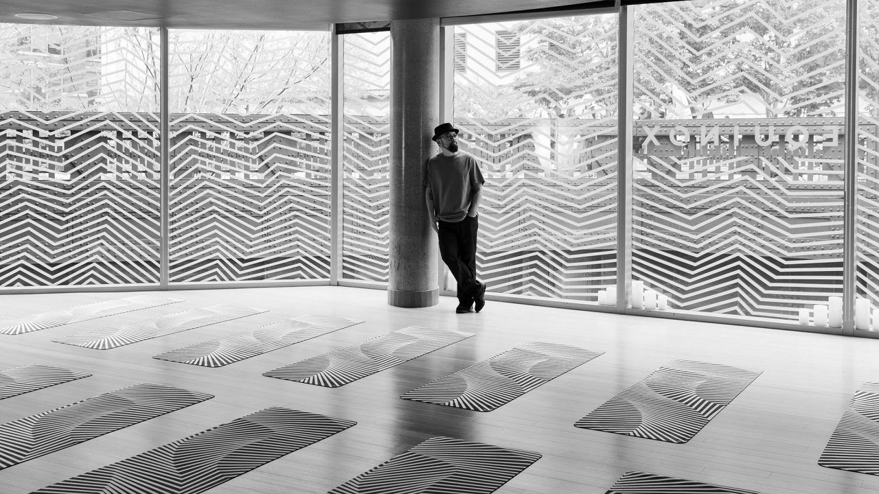 Portrait of Darel Carey in the yoga studio