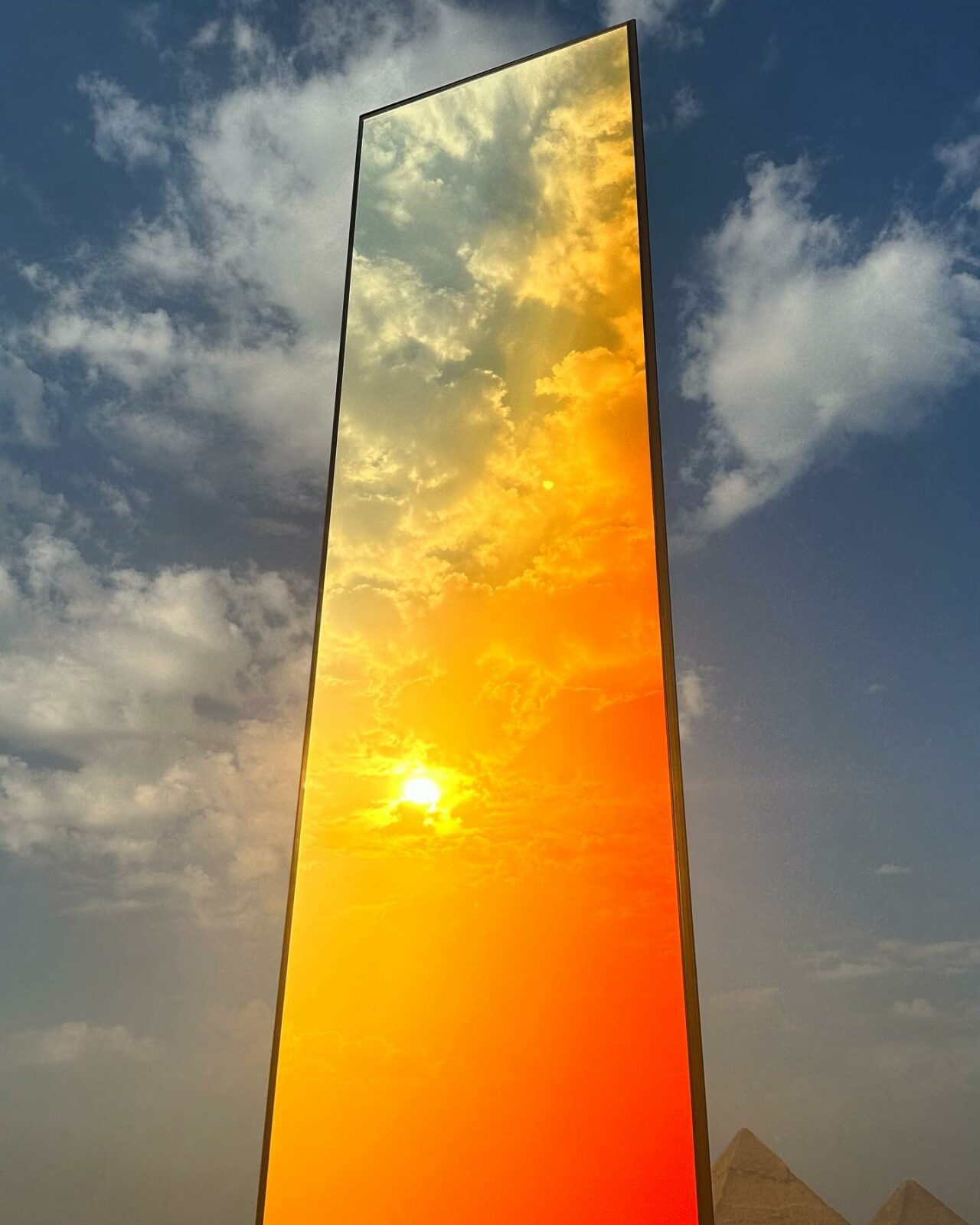 'RA' at Forever Is Now Edition III - Photo by _ STUDIO SABINE MARCELIS _ in Pyramid,Giza,Egypt with @sabine_marcelis, @artdegypte, @nadine_abdelghaffar.official, and @sol_rnd. May be an image of mirror, monument and tower.