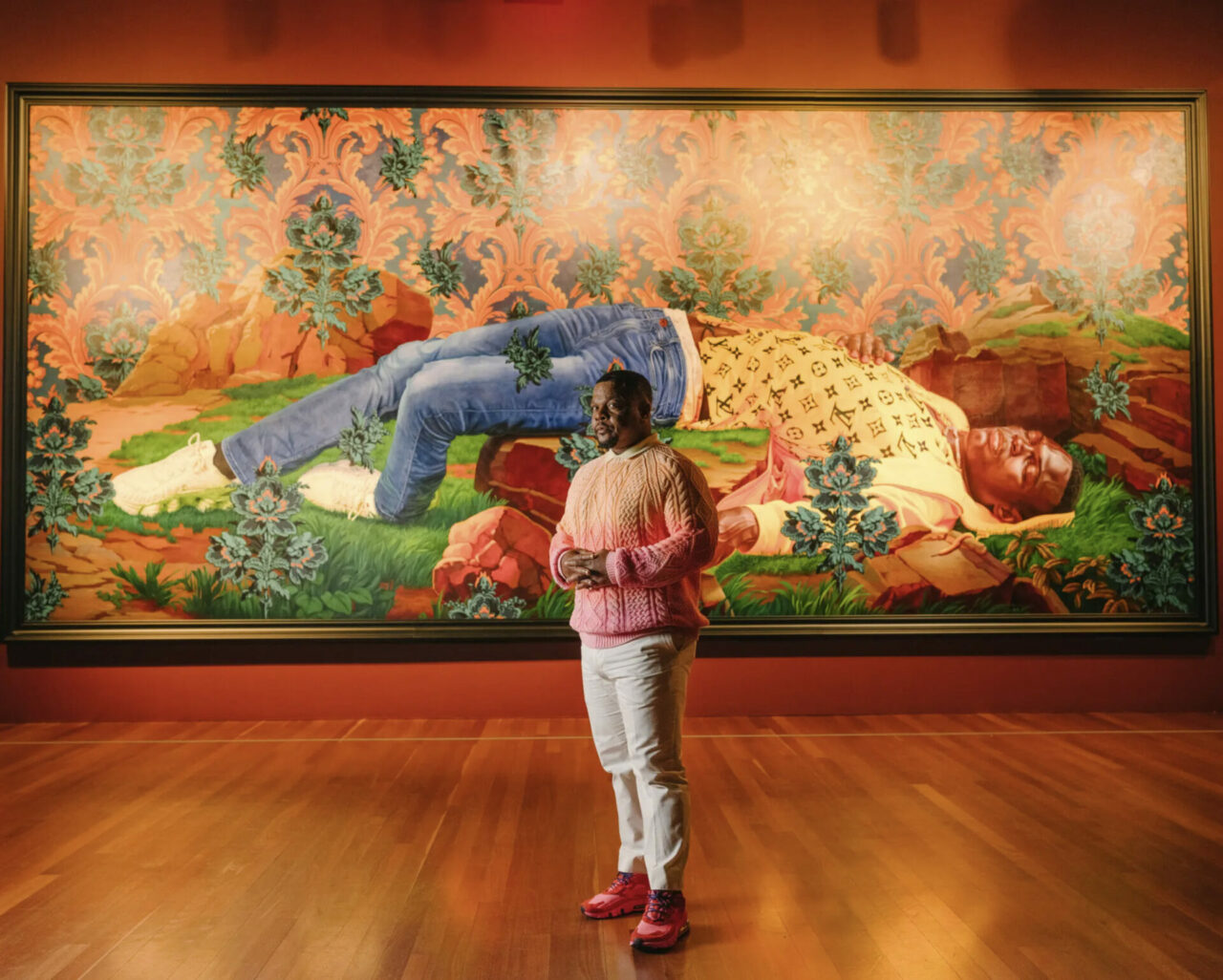 Kehinde Wiley at &ldquo;An Archaeology of Silence&rdquo; at the de Young Museum in San Francisco with his monumental 2022 painting, &ldquo;Femme piqu&eacute;e par un serpent (Mamadou Gueye).&rdquo; Works were made in response to the killings of Black men and women &mdash; &ldquo;bodies chopped down,&rdquo; the artist said. This one nods to an 1847 sculpture &ldquo;Woman Bitten by a Serpent&rdquo; by Auguste Cl&eacute;singer.